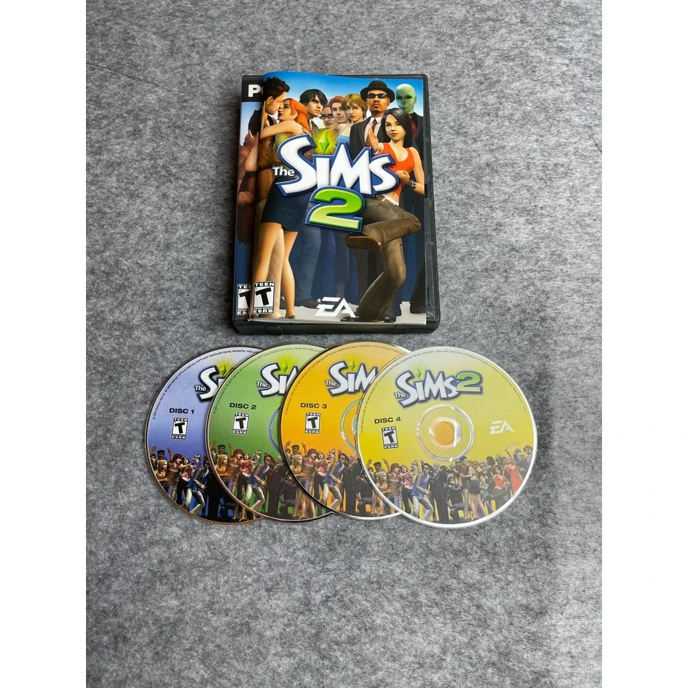 The Sims 2 PC CD-ROM Video Game 4-Disc Set with Manual EA Includes Serial‎ Code